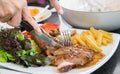 Grilled steak, French fries and vegetables