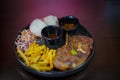 Grilled steak with French fries and vegetables on black background Royalty Free Stock Photo