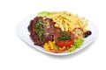 Grilled steak with french fries and vegetables on Royalty Free Stock Photo