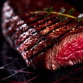 Grilled Steak with herbs cooking over flaming grill