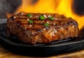 Grilled steak with herbs and flames Royalty Free Stock Photo