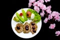 Grilled steak meat with Pink flower isolated on black background