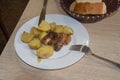 Grilled steak, potato and bread on a plate. bread on the table Royalty Free Stock Photo