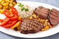 Grilled steak with potato rice and vegetables on white backgournd