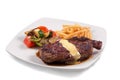 Grilled Steak served with Hollandaise sauce, fries, and stir fry / sauteed vegetable