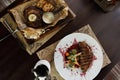 Grilled steak `Striploin` with baked vegetables in a wine sauce. Pork steak with grilled eggplants and with sauce. Royalty Free Stock Photo
