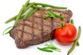 Grilled steak with tomato and green beans,isolated Royalty Free Stock Photo