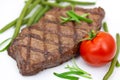 Grilled steak with tomato and green beans,isolated Royalty Free Stock Photo