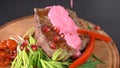 Grilled steak watered in sauce. slow motion