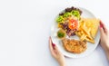 Grilled steaks, baked potatoes and vegetables on white plate on Royalty Free Stock Photo