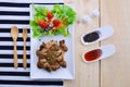 Grilled steaks, pork with pepper gravy and vegetable salad Royalty Free Stock Photo