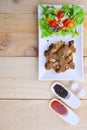 Grilled steaks, pork with pepper gravy and vegetable salad