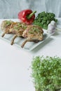 Grilled steaks from pork ribs with spices and herbs. Bone steak. Side view. Dark wooden background Royalty Free Stock Photo