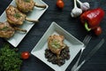 Grilled steaks from pork ribs with spices and herbs. Bone steak. Side view. Dark wooden background Royalty Free Stock Photo