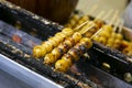 Grilled Sticky Rice Ball in street kiosk. Traditional Japanese food Mochi Royalty Free Stock Photo