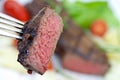 Grilled strip steak with tomato and salad Royalty Free Stock Photo