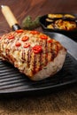 Grilled striploin on grill pan and fried eggplant on wooden background Royalty Free Stock Photo