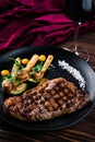 Grilled striploin steak with spices and herbs, strip steak New York strip. Royalty Free Stock Photo