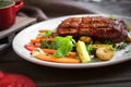 Grilled Chuck beef steak with vegetables on plate