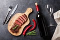 Grilled striploin steak and wine