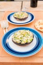 Grilled stuffed portobello mushrooms with feta cheese and scallions.