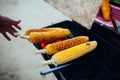 Grilled sweet corn near the beach during sunset time,barbecue concept, in Bali, Indonesia
