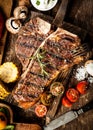 Grilled t-bone steak in a rustic kitchen Royalty Free Stock Photo