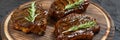 Grilled T-bone Steaks on stone table. Top view with copy space