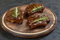 Grilled T-bone Steaks on stone table. Top view with copy space