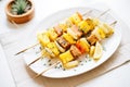 grilled tempeh skewers with chunks of pineapple and onion