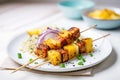 grilled tempeh skewers with chunks of pineapple and onion