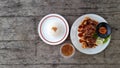 Grilled teriyaki chicken wings with cucumber slice dan chili sauce. Royalty Free Stock Photo