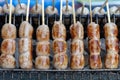 Grilled Thai sausage at street food market in Thailand, closeup. Traditional Thai sausage with pork and rice, delicious street Royalty Free Stock Photo