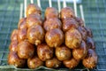 Grilled Thai sausage at street food market in Thailand, closeup. Traditional Thai sausage with pork and rice, delicious street Royalty Free Stock Photo