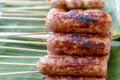 Grilled Thai sausage at street food market in Thailand. Traditional Thai sausage with pork and rice, delicious street food Royalty Free Stock Photo