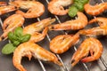 Grilled tiger shrimps. Leaves of green basil. Grilled seafood