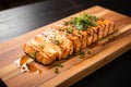 grilled tofu steak resting on a wooden board