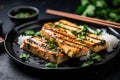 grilled tofu steak sprinkled with cilantro and black sesame seeds