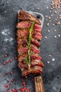 Grilled top blade, Denver steak. Marble meat beef. Black background. Top view