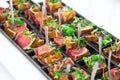 Grilled tuna chunks served with fresh green herbs Royalty Free Stock Photo