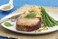 Grilled tuna steak with basil olive oil Royalty Free Stock Photo