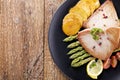 Grilled tuna steak served on asparagus with roasted potatoes Royalty Free Stock Photo