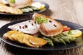 Grilled tuna steak served on asparagus with roasted potatoes Royalty Free Stock Photo