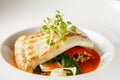 Grilled turbot, tabouli, sweet pepper sauce and summer vegetables. White dish Royalty Free Stock Photo