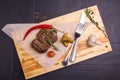 Grilled veal steak with vegetables on a plate Royalty Free Stock Photo