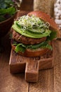 Grilled vegan bean burger with greens