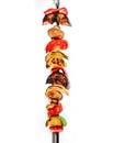 Grilled vegetable kebabs on skewers with cherry tomato, pepper, mushrooms, squash and onion on white background. Royalty Free Stock Photo