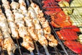 Grilled vegetable and meat skewers in a herb marinade on a grill pan, top view Royalty Free Stock Photo