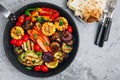 Grilled Vegetable Platter with Zucchini, mushrooms, eggplant, carrots, pepper bell, tomato, onions, corn, and Yogurt Mint Sauce Royalty Free Stock Photo