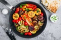 Grilled Vegetable Platter with Zucchini, mushrooms, eggplant, carrots, pepper bell, tomato, onions, corn, and Yogurt Mint Sauce Royalty Free Stock Photo